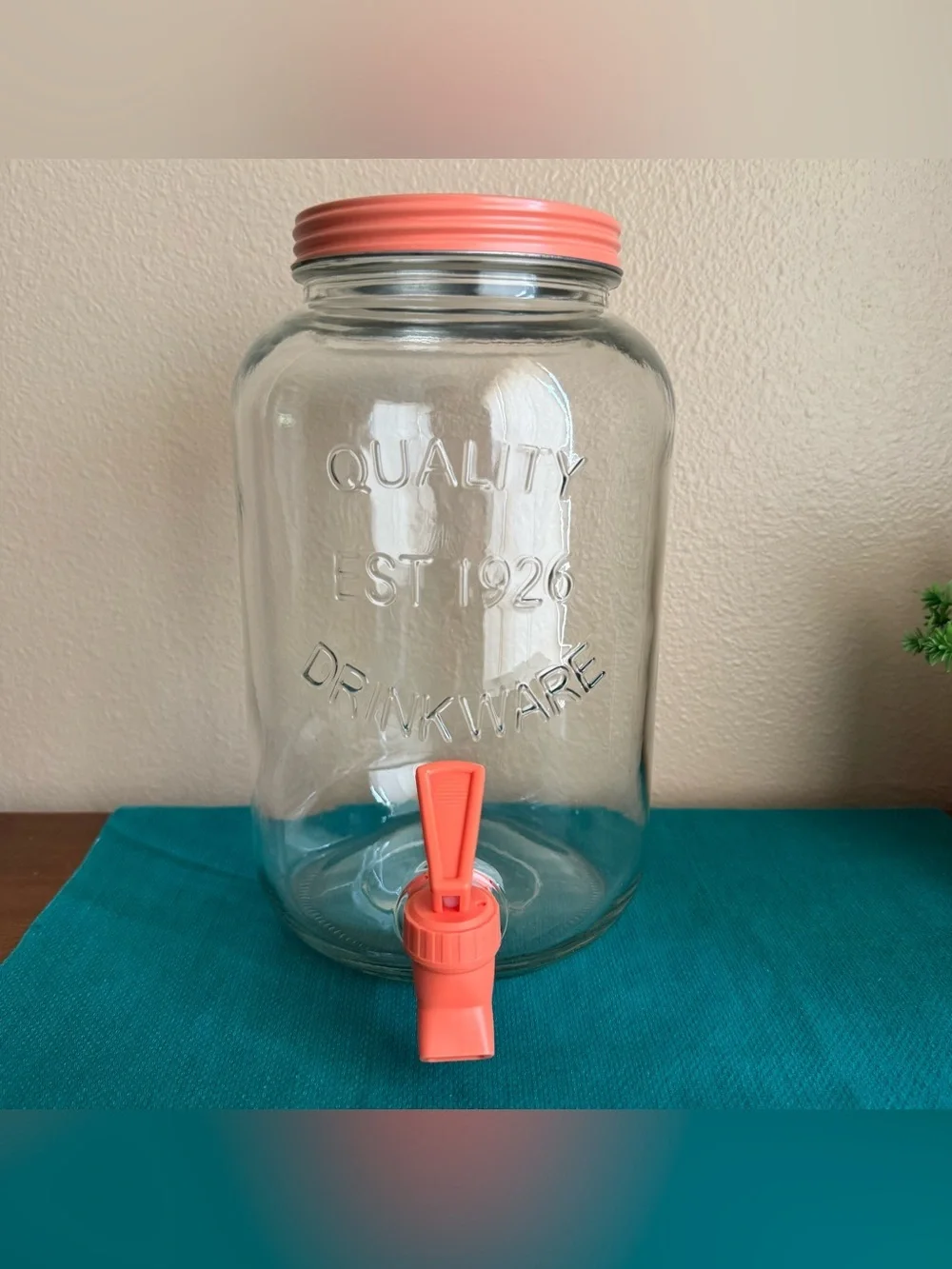 Quality Drinkware large beverage dispenser with salmon pink/peach lid